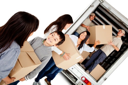 Moving truck and packed boxes representing a Bayswater removals quote