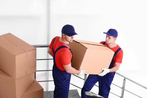 Packed moving boxes in a Bayswater apartment hallway