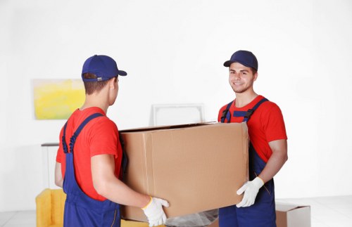 Preparing boxes and furniture for a moving truck in Bayswater