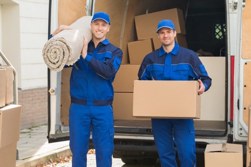 Workers securing items inside a moving vehicle