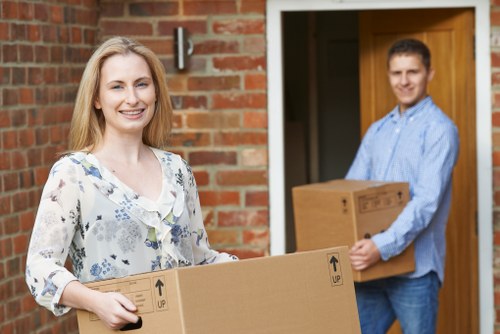 Experienced removalists managing furniture during a home move