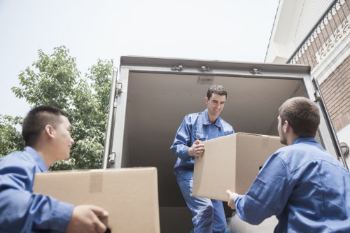 Movers Bayswater van with recyclable moving boxes being loaded for a sustainable move