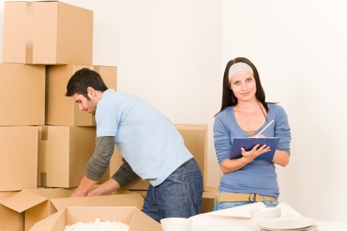 Professional team loading unwanted furniture for pick-up in Bayswater
