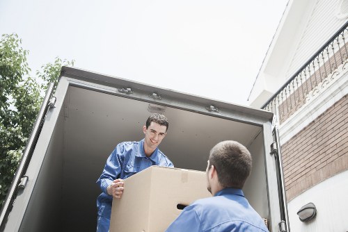 Team reviewing safety procedures to maintain standards during moving work